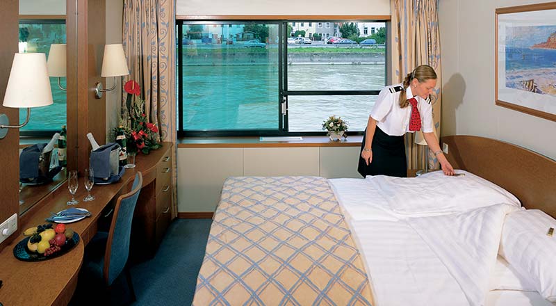Viking crew cleaning deluxe stateroom