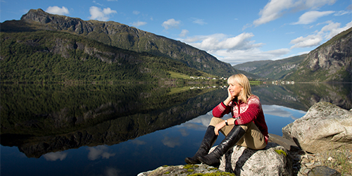 Karine Hagen sitting on boulder in fjord